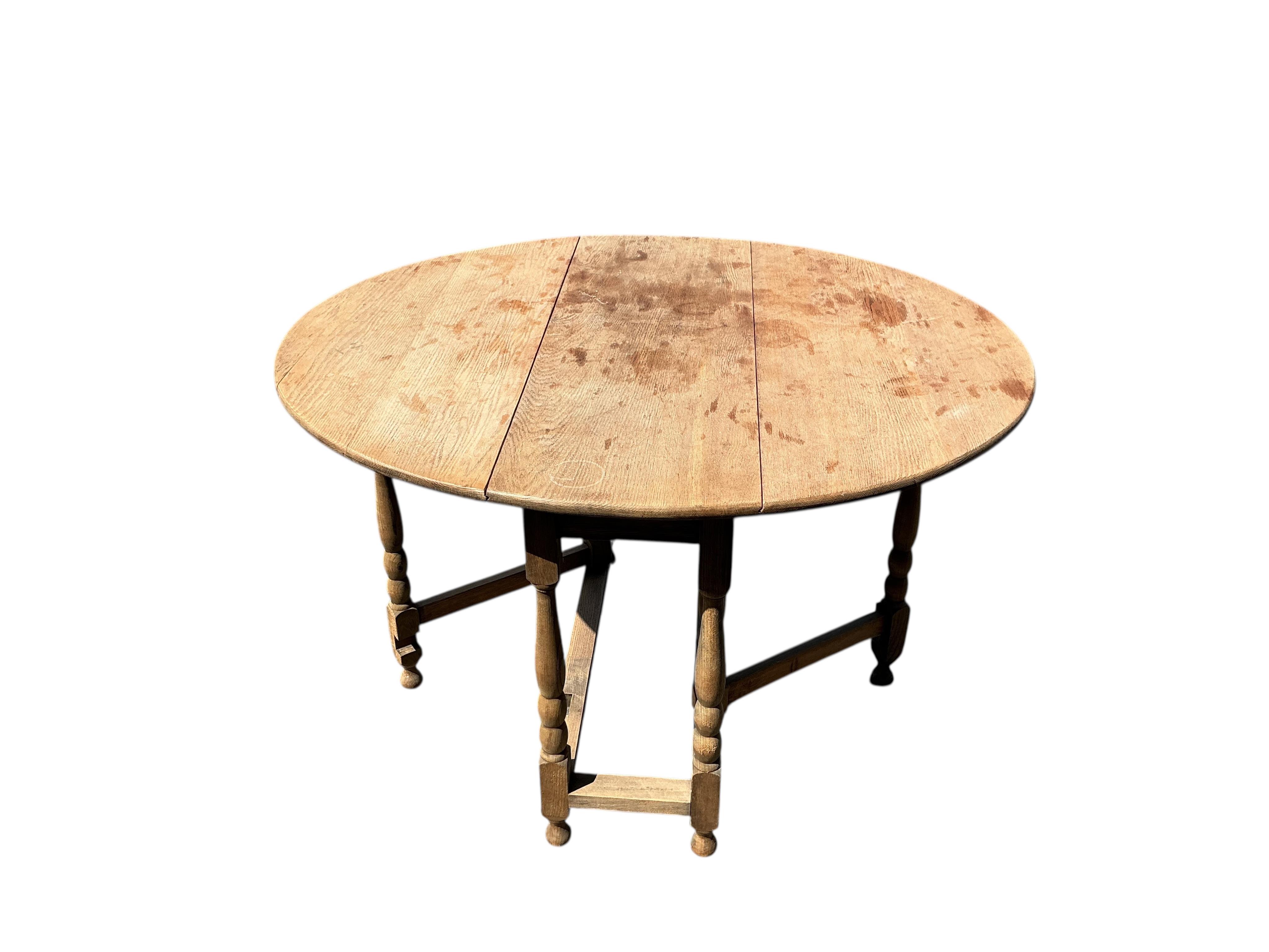 A bleached oak gateleg table, width 99cm, depth 37cm, height 72cm